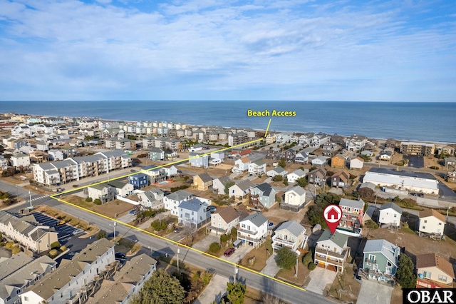 drone / aerial view featuring a water view and a residential view