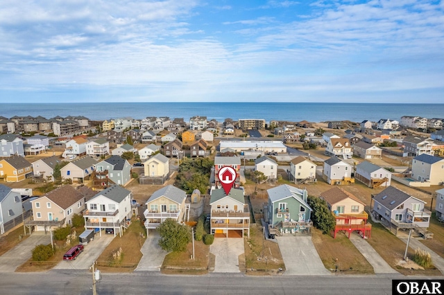 aerial view featuring a residential view and a water view