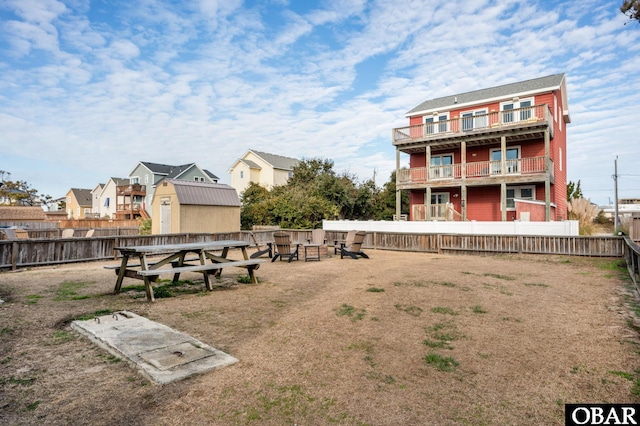 view of home's community with a fenced backyard