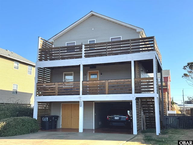 back of house with stairway and a balcony