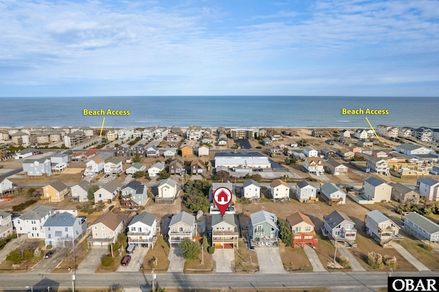 drone / aerial view featuring a water view and a residential view