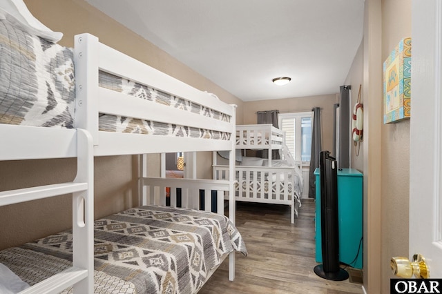 bedroom with wood finished floors