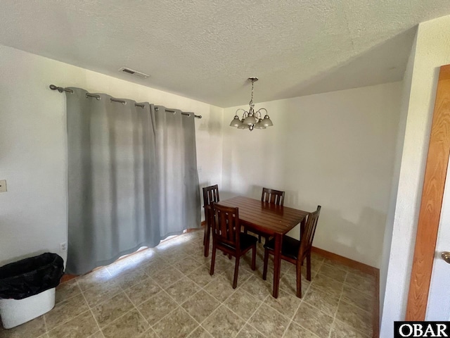269 Lakeview Ct Lot 12, Engelhard, NC 27824 - dining room featuring a chandelier and a textured ceiling