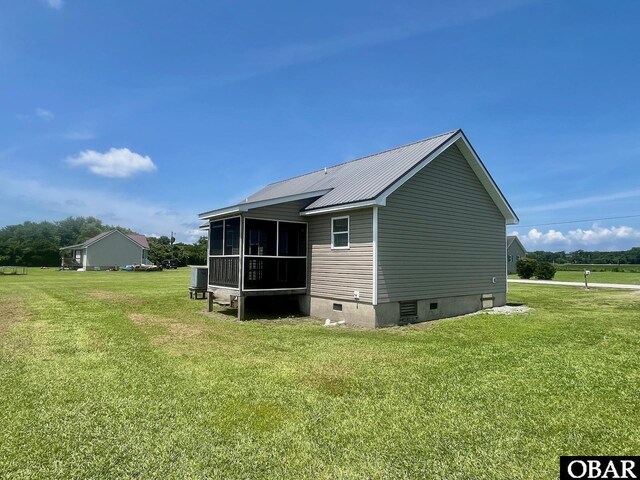 269 Lakeview Ct Lot 12, Engelhard, NC 27824 - back of property with crawl space, a sunroom, a lawn, and a metal roof
