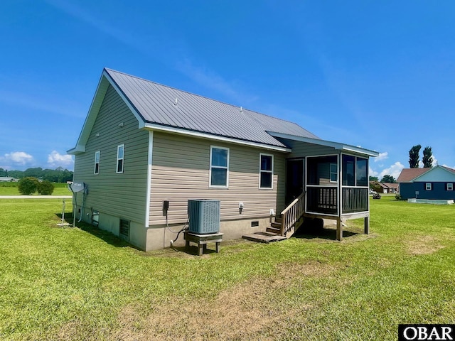 269 Lakeview Ct Lot 12, Engelhard, NC 27824 - rear view of house with a sunroom, a lawn, and a metal roof