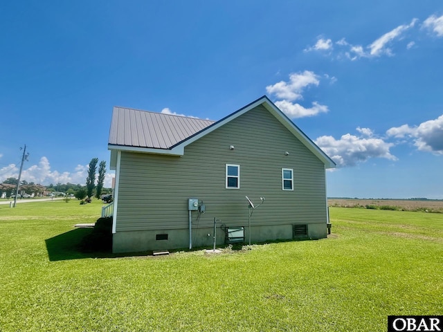 269 Lakeview Ct Lot 12, Engelhard, NC 27824 - view of side of property featuring a lawn and a metal roof