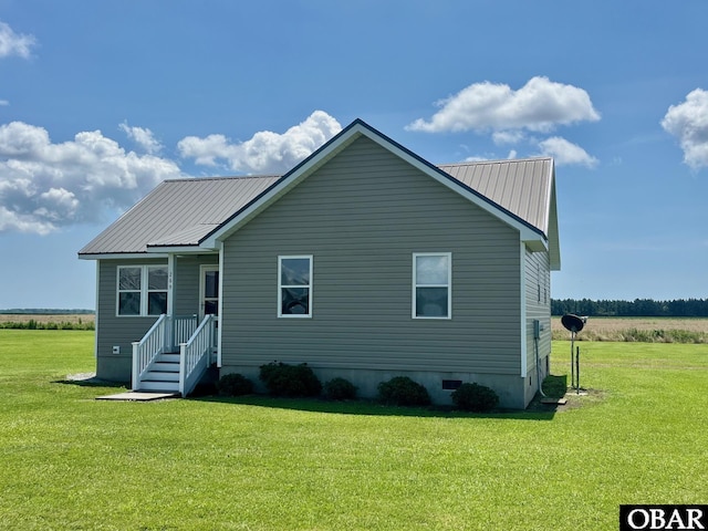 269 Lakeview Ct Lot 12, Engelhard, NC 27824 - rear view of house with a lawn and a metal roof
