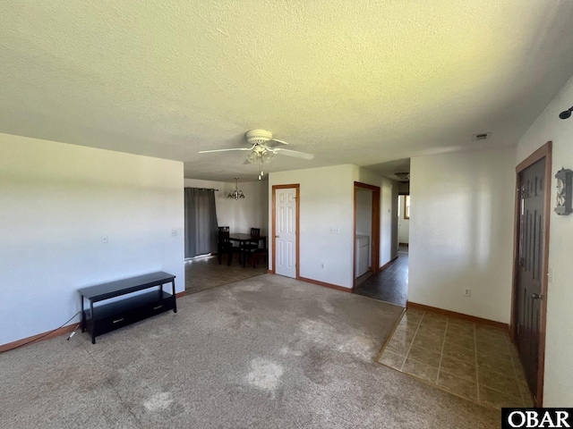 269 Lakeview Ct Lot 12, Engelhard, NC 27824 - tiled empty room with a textured ceiling, ceiling fan, and carpet