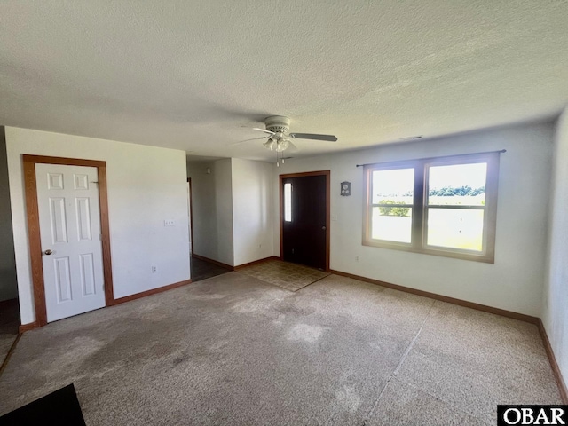 269 Lakeview Ct Lot 12, Engelhard, NC 27824 - unfurnished room with a ceiling fan, carpet, and a textured ceiling