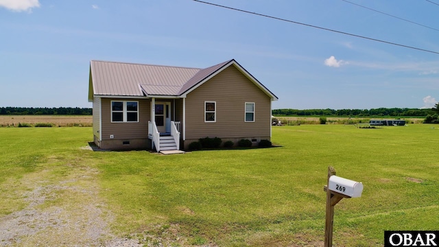 269 Lakeview Ct Lot 12, Engelhard, NC 27824 - view of front of property featuring crawl space, a front yard, a metal roof, and a view of rural / pastoral area