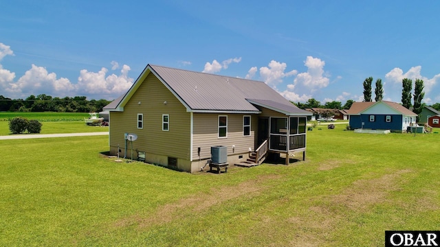 269 Lakeview Ct Lot 12, Engelhard, NC 27824 - back of property with a lawn, a sunroom, and a metal roof