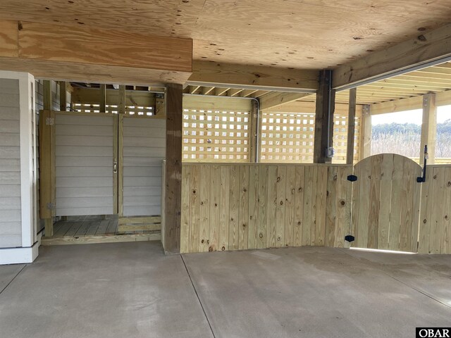 unfurnished living room with dark wood-type flooring, a high ceiling, baseboards, and stairs