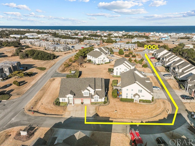 bird's eye view featuring a residential view and a water view