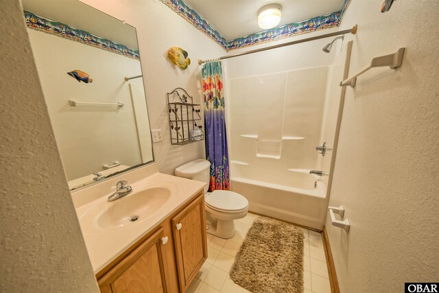 56186 Lonesome Valley Rd Lot 3, Hatteras, NC 27943 - bathroom featuring toilet, a textured wall, vanity, shower / tub combo, and tile patterned floors