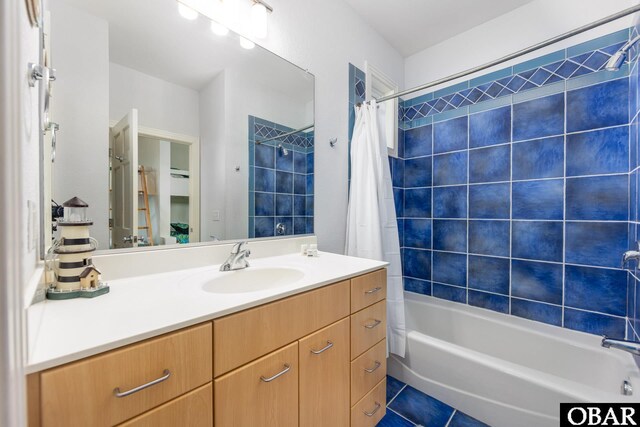 bathroom with shower / bath combination with curtain, vanity, and tile patterned floors