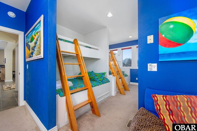 carpeted bedroom with recessed lighting, visible vents, and baseboards