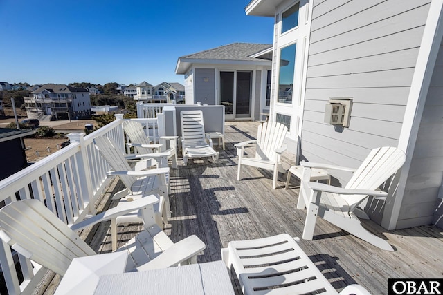 wooden deck with a residential view