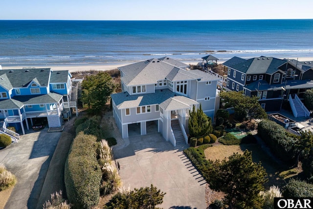 drone / aerial view with a water view and a residential view