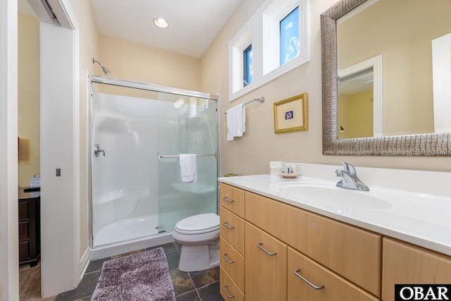 full bathroom featuring toilet, a shower stall, recessed lighting, and vanity