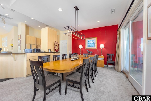 dining room featuring recessed lighting, light carpet, and visible vents