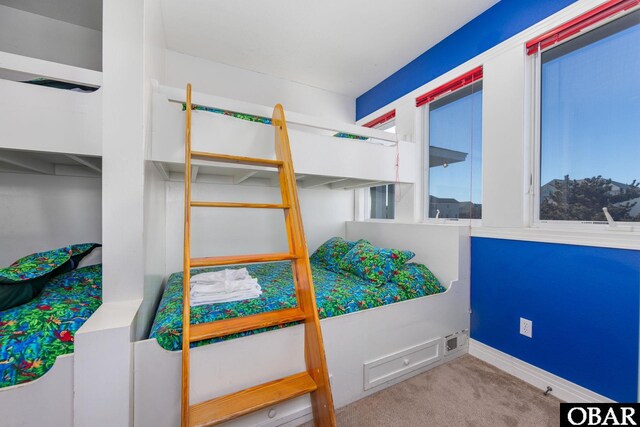 carpeted bedroom with baseboards