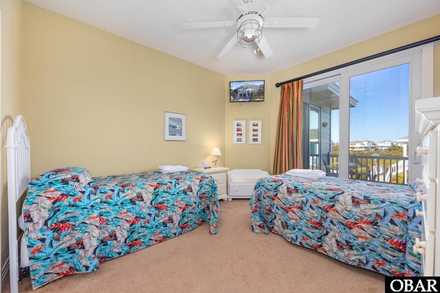 bedroom with carpet floors, a ceiling fan, and access to exterior