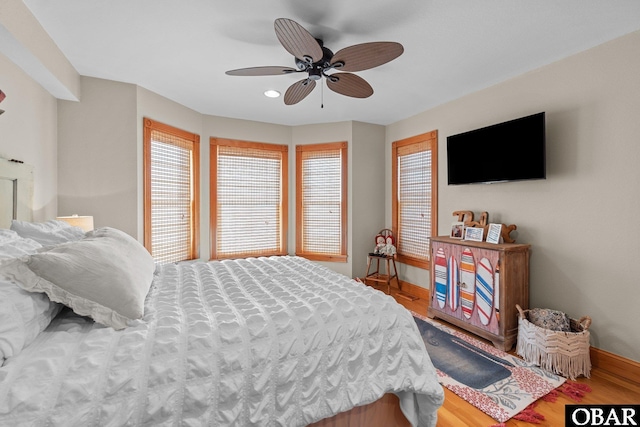 bedroom with ceiling fan, baseboards, wood finished floors, and recessed lighting