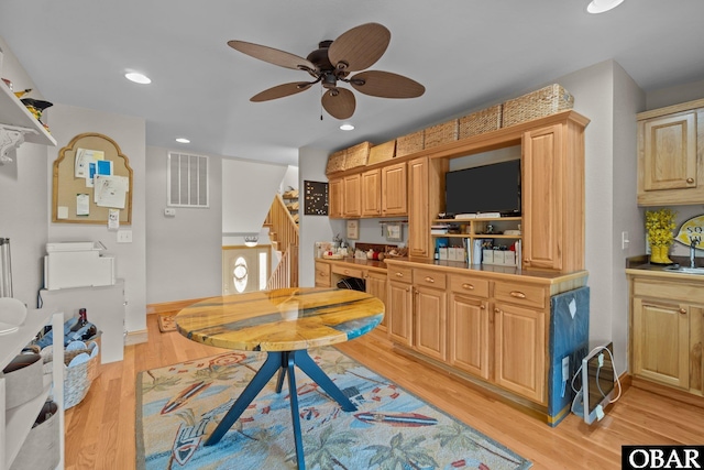 kitchen with built in desk, recessed lighting, visible vents, light wood-style floors, and baseboards