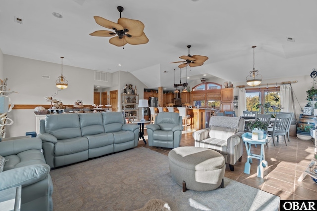 living area with lofted ceiling, visible vents, a ceiling fan, and light tile patterned flooring