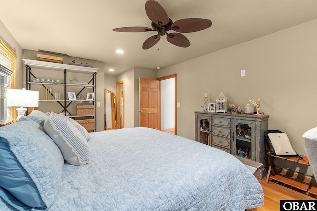 bedroom featuring recessed lighting, ceiling fan, and wood finished floors