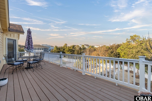 deck with outdoor dining space