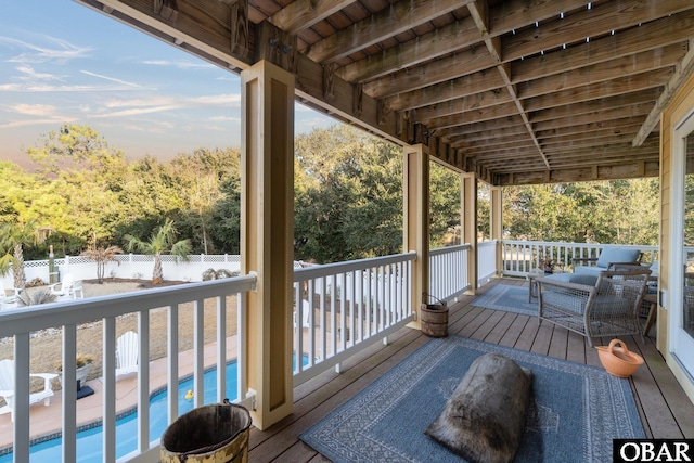 wooden terrace with a fenced backyard and a fenced in pool