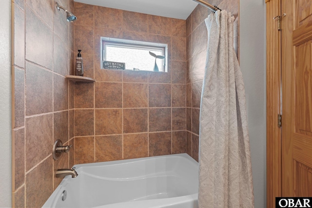 full bathroom featuring shower / bath combo with shower curtain