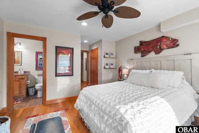 bedroom featuring recessed lighting, a ceiling fan, baseboards, light wood-type flooring, and ensuite bath