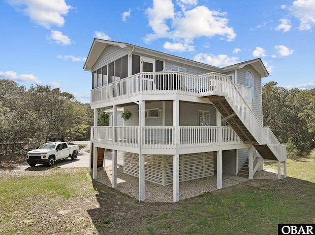 318 Duck Rd Lot 14, Southern Shores, NC 27949 - back of property with stairway, a wooden deck, a sunroom, and a yard