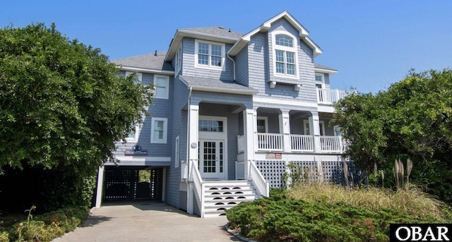 273 Whites Pt Lot 183, Corolla, NC 27927 - view of front facade with covered porch, driveway, and a carport
