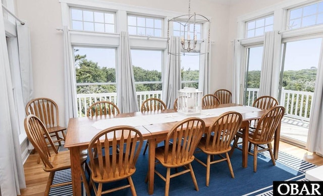 273 Whites Pt Lot 183, Corolla, NC 27927 - dining room with light wood finished floors and a chandelier