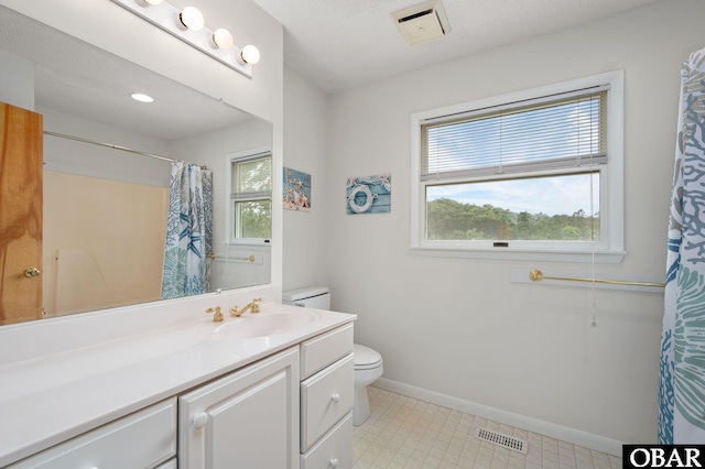 1045 Whalehead Dr Lot 27, Corolla, NC 27927 - bathroom featuring toilet, vanity, baseboards, tile patterned floors, and a shower with shower curtain