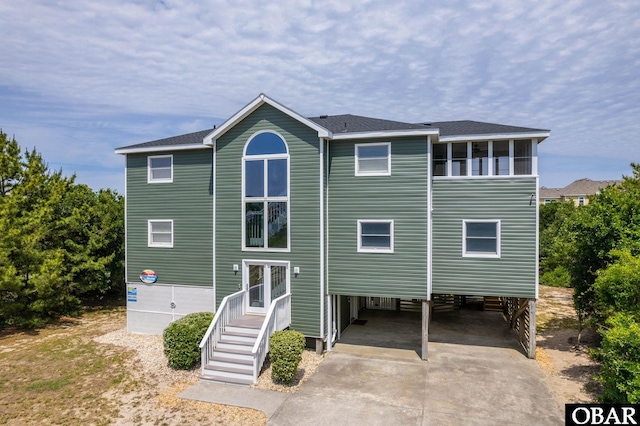 1045 Whalehead Dr Lot 27, Corolla, NC 27927 - rear view of house featuring a carport