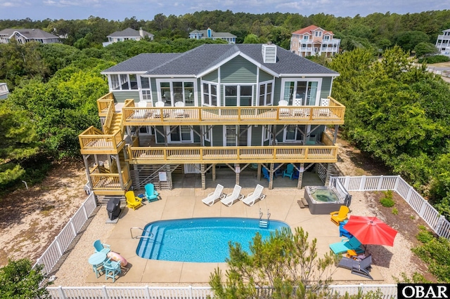 1045 Whalehead Dr Lot 27, Corolla, NC 27927 - back of house with a wooden deck, stairway, a fenced backyard, and a shingled roof
