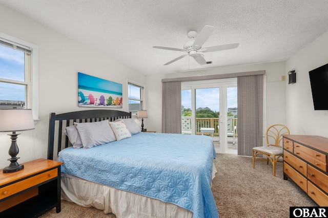 1045 Whalehead Dr Lot 27, Corolla, NC 27927 - bedroom featuring carpet floors, access to exterior, a textured ceiling, and ceiling fan