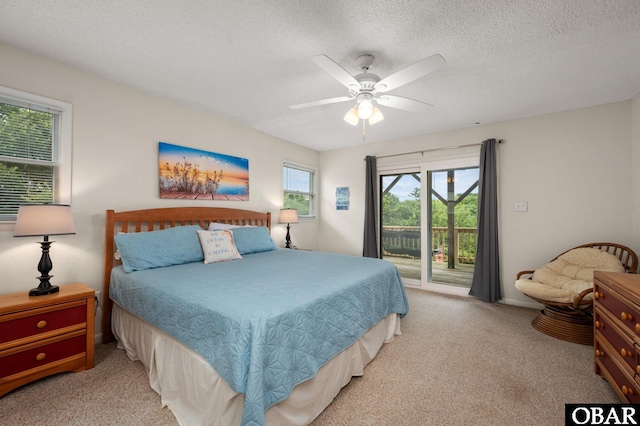 1045 Whalehead Dr Lot 27, Corolla, NC 27927 - bedroom featuring access to outside, carpet floors, ceiling fan, and a textured ceiling