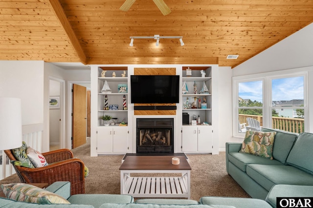1045 Whalehead Dr Lot 27, Corolla, NC 27927 - carpeted living area with vaulted ceiling, wooden ceiling, a large fireplace, and built in shelves