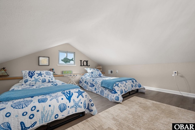 300 S Virginia Dare Trl Lot 1, Kill Devil Hills, NC 27948 - bedroom with wood finished floors and vaulted ceiling