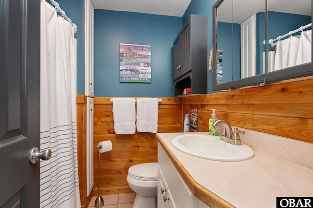 300 S Virginia Dare Trl Lot 1, Kill Devil Hills, NC 27948 - bathroom featuring vanity, tile patterned floors, wooden walls, and a shower with shower curtain
