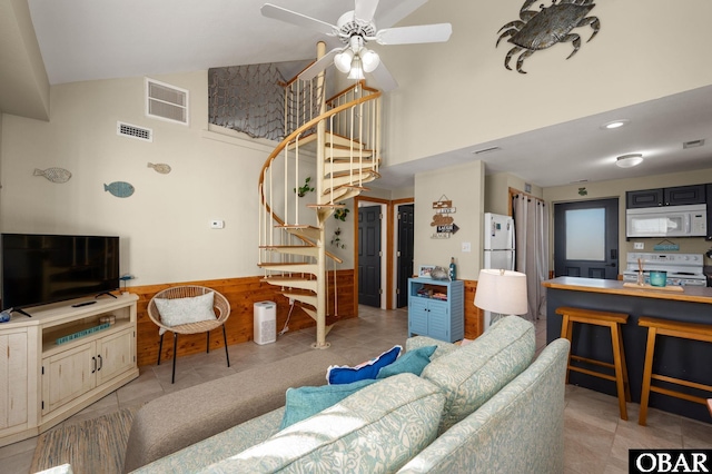 300 S Virginia Dare Trl Lot 1, Kill Devil Hills, NC 27948 - tiled living area featuring stairs, ceiling fan, and a high ceiling