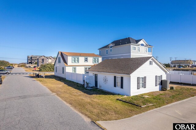 300 S Virginia Dare Trl Lot 1, Kill Devil Hills, NC 27948 - view of side of home with a central air condition unit and a residential view