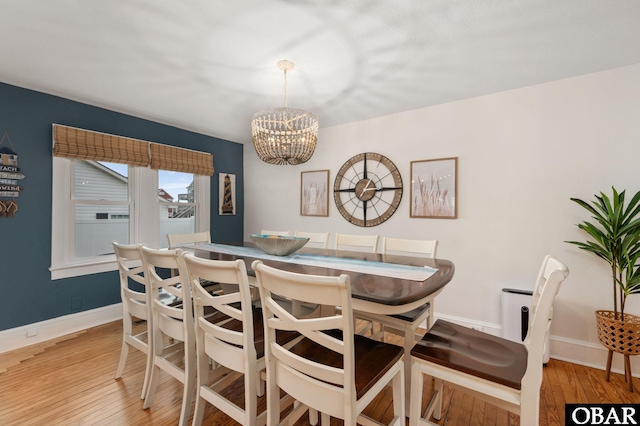 300 S Virginia Dare Trl Lot 1, Kill Devil Hills, NC 27948 - dining room with a chandelier and light wood-style flooring