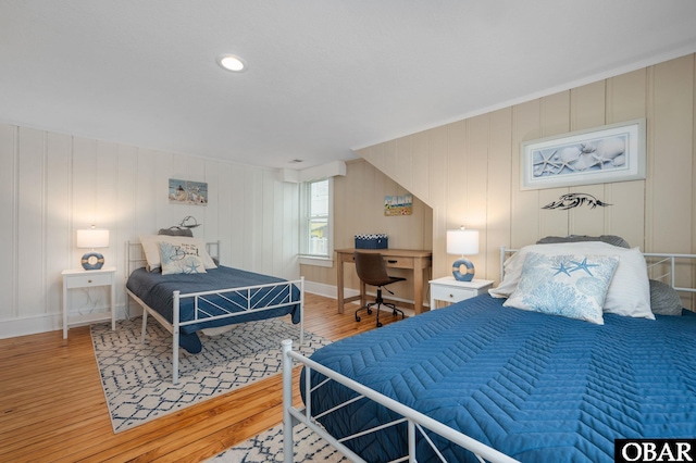 300 S Virginia Dare Trl Lot 1, Kill Devil Hills, NC 27948 - bedroom with wood finished floors and a decorative wall