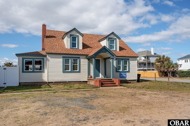 300 S Virginia Dare Trl Lot 1, Kill Devil Hills, NC 27948 - cape cod house featuring roof with shingles and a chimney